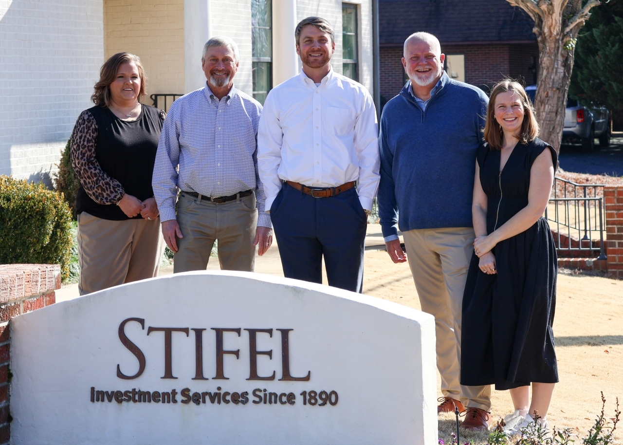Stillwater Wealth Advisory Group team image in front of office